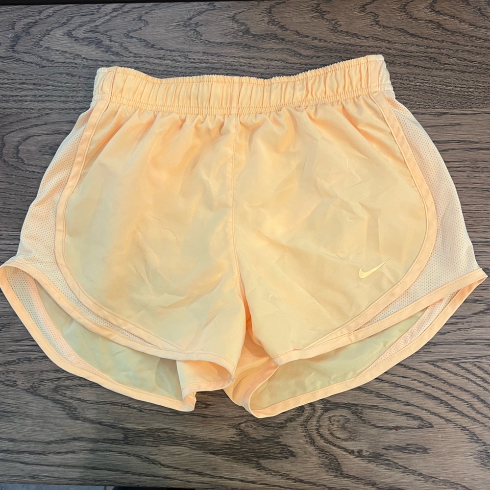 Yellow Nike running shorts
